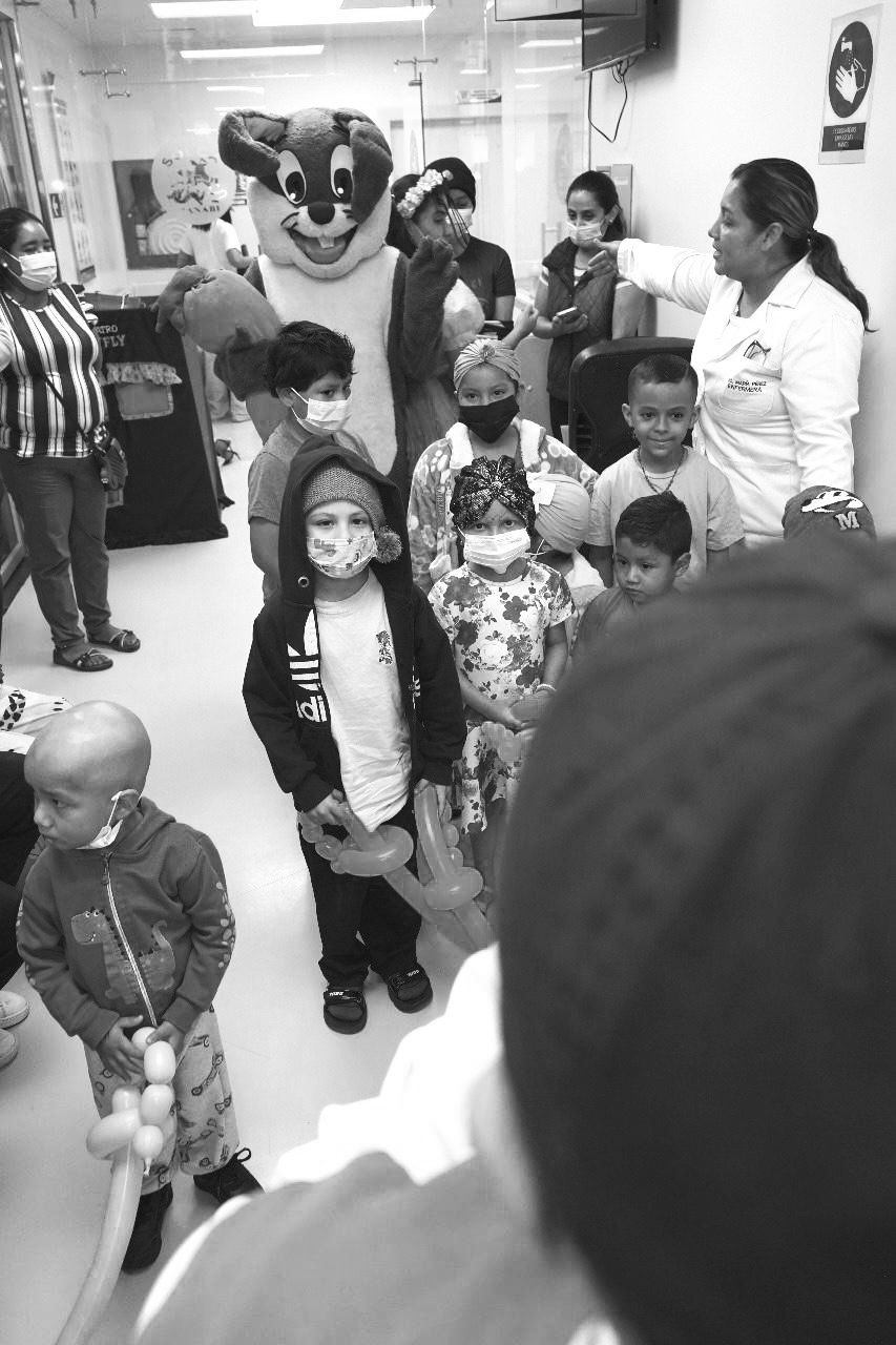 Children with mascot during a hospital visit.