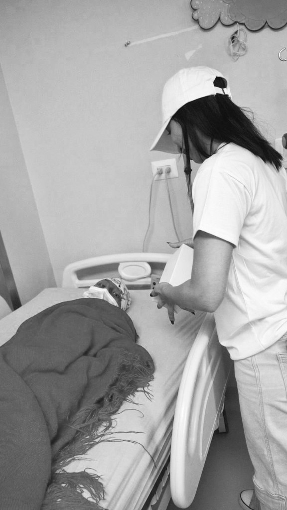 Visit to a patient and family in a hospital room.