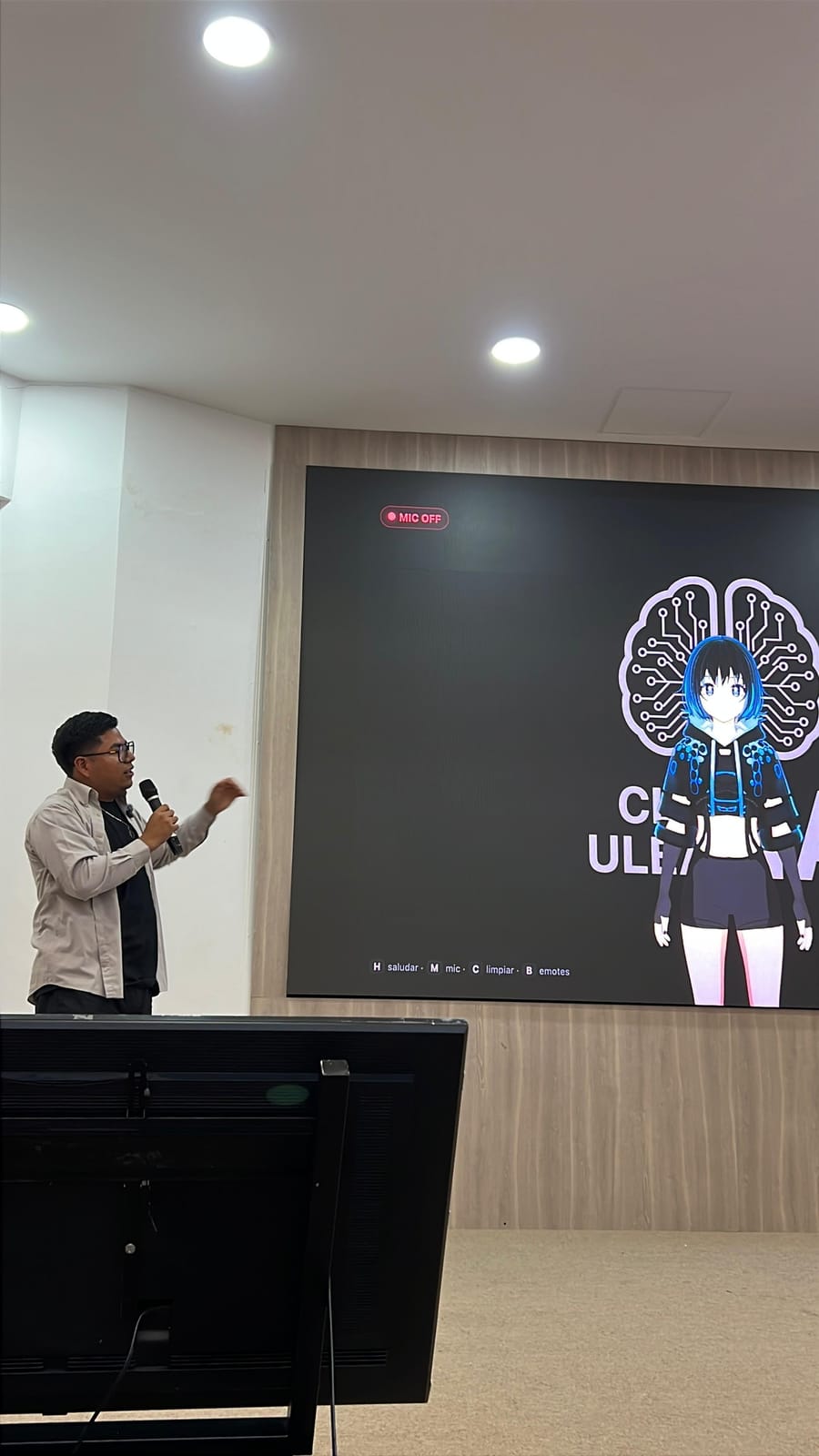 Josue Castro presenting a live AI avatar demo on a large screen