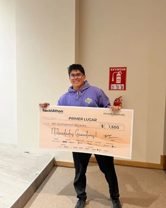 Leopoldo Muniz holding the hackIAthon first place check for $1,500